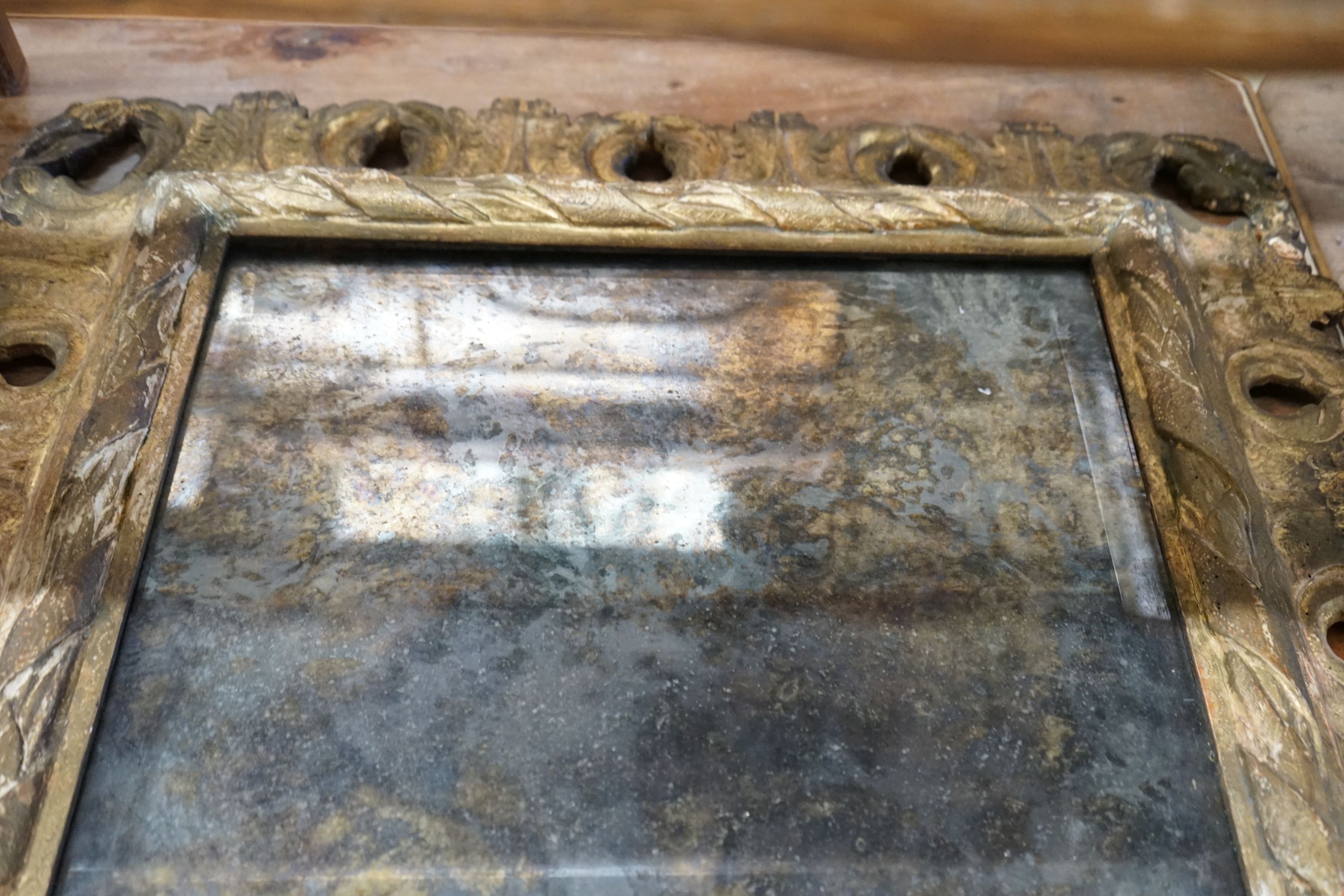 An 18th century gilt-framed wall mirror, width 75cm, height 72cm